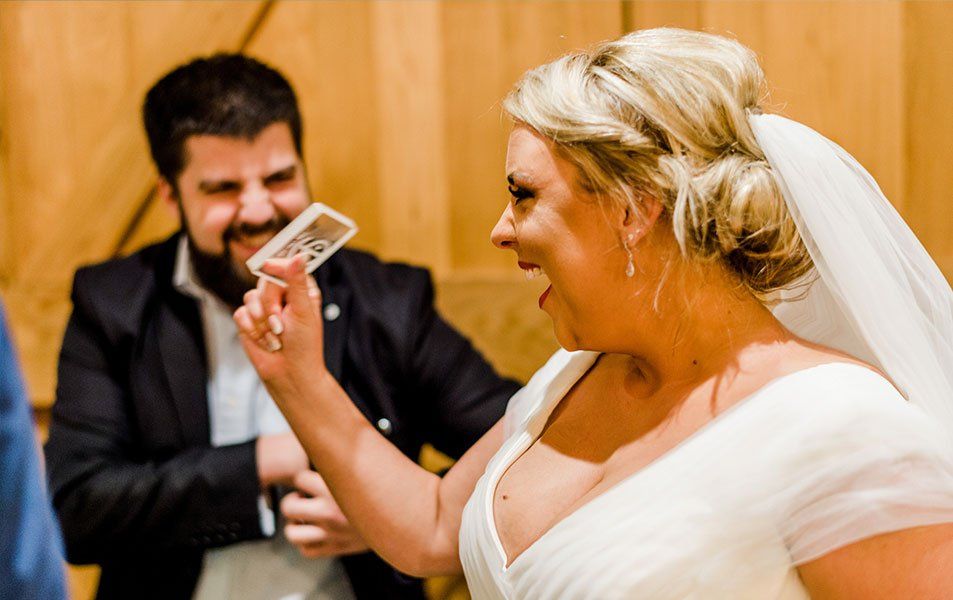 Wedding magician Daniel Chard performing close-up magic for guests at a Bristol wedding