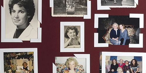 Maroon wall with a collage of framed family photos in white mats and black frames