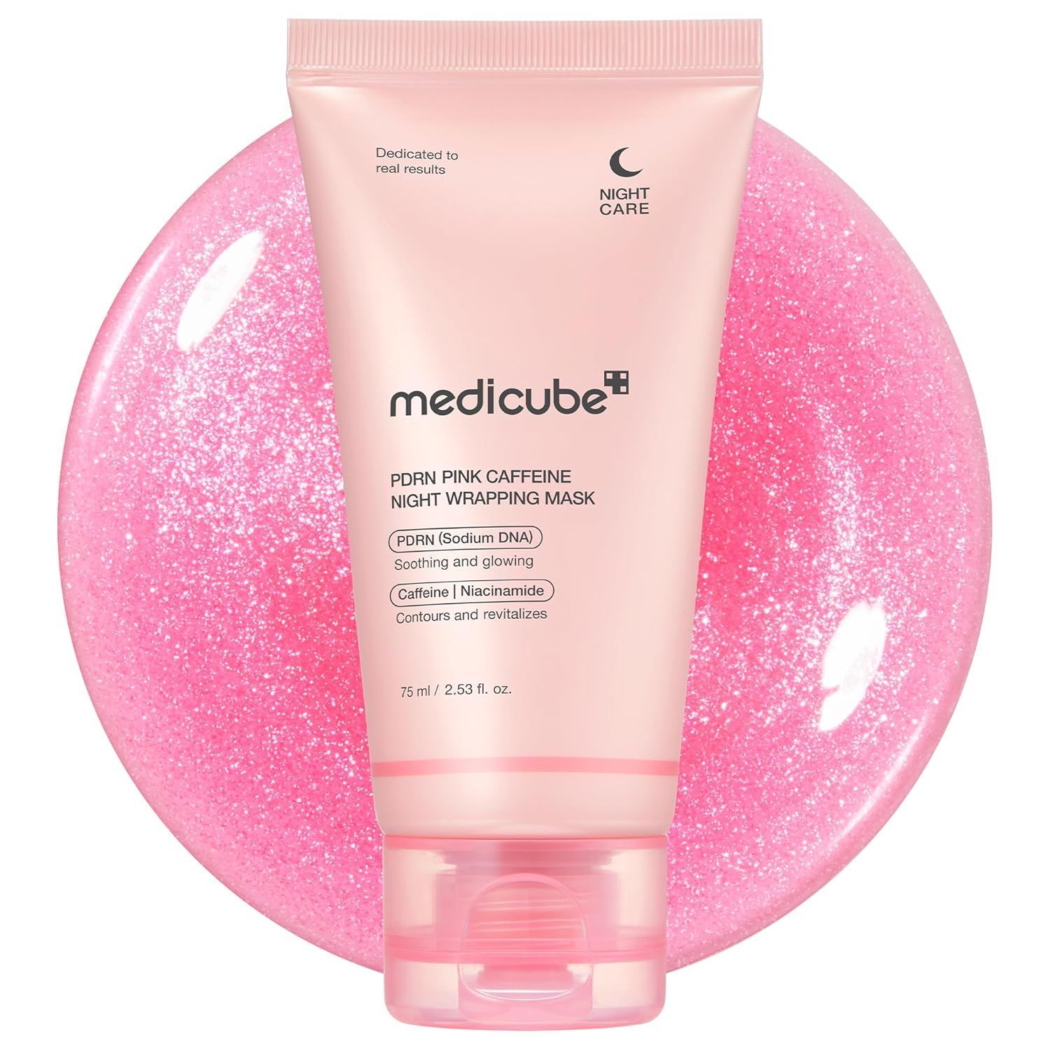 Pink Medicube night sleeping face mask tube on a shimmery pink circle.