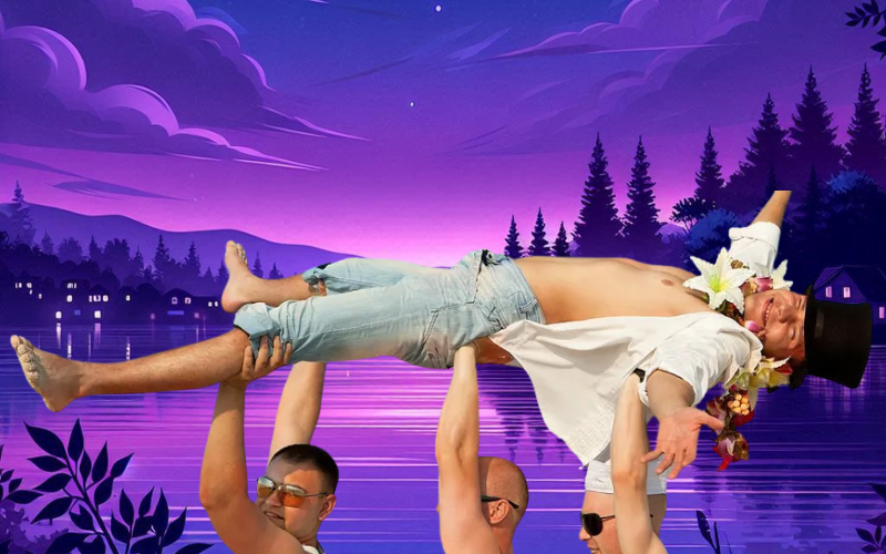 Three men holding up a man in a top hat by a lake at dusk. The man is smiling, shirtless.