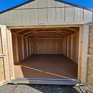 Open wooden shed with double doors, showing an empty interior and brown floor.
