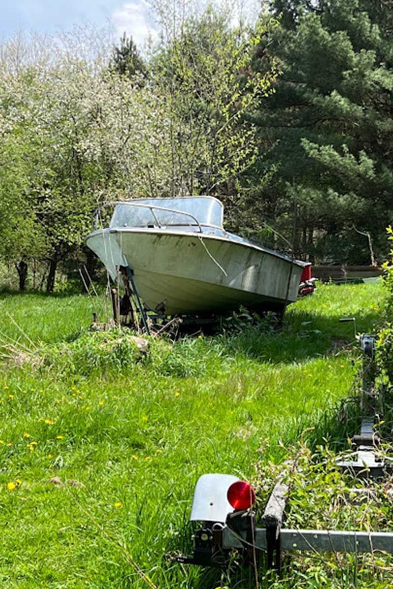 old boat in yard, boat removal and haul away services in central OH