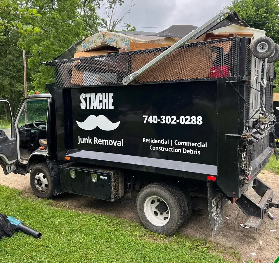 Stache junk removal trailer full of furniture and appliances