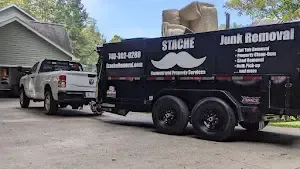 a truck is towing a trailer with a mustache on it .