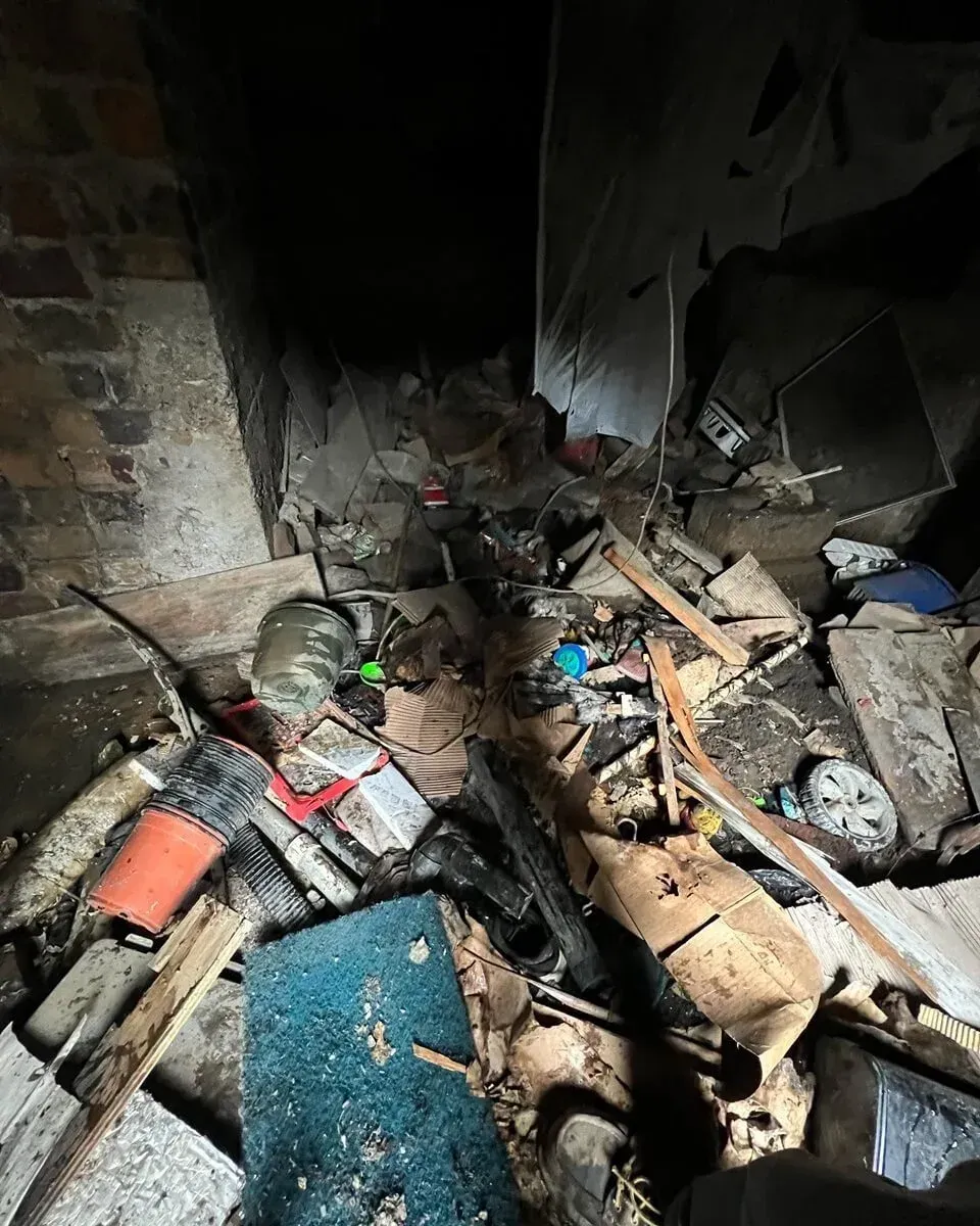 a cluttered, dirty crawlspace in a farmhouse in Nelsonville OH, farm cleanouts, Stache Junk Removal