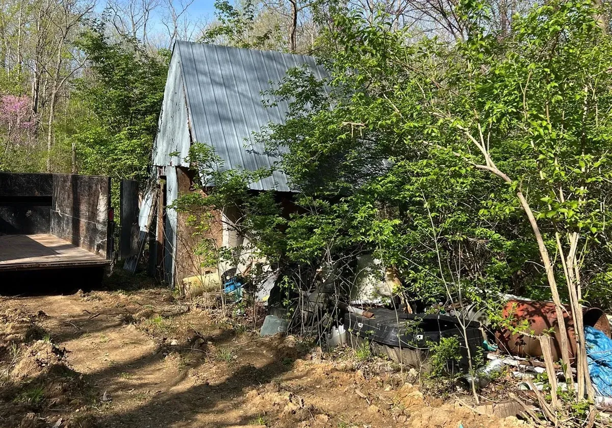 old barn in the bush with junk all around, barn removal in central oh
