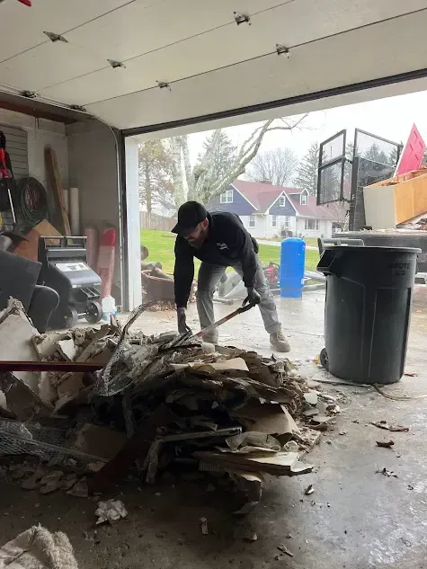 Stache Crew Cleaning a Garage