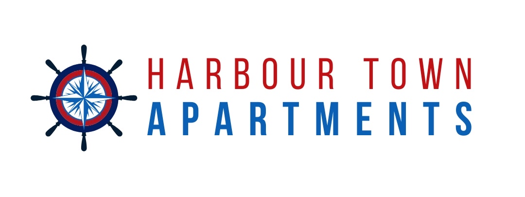 The logo for harbour town apartments has a compass on it