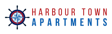The logo for harbour town apartments has a compass on it