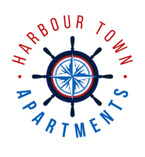 A logo for harbour town apartments with a compass in the center