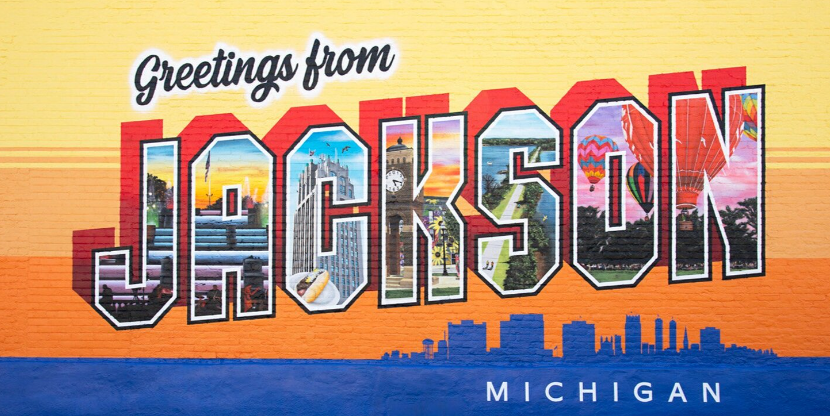 A postcard that says greetings from jackson michigan