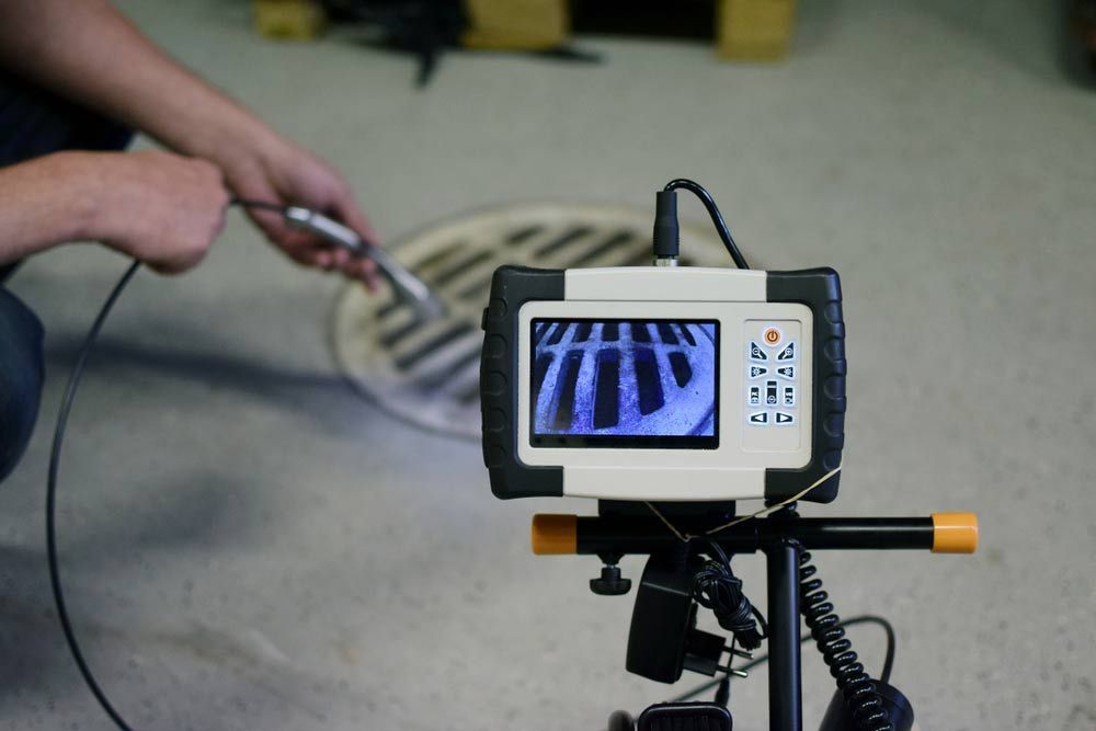Man Using Pipe Camera for Sewer Inspection — Plumbing in Wollongong