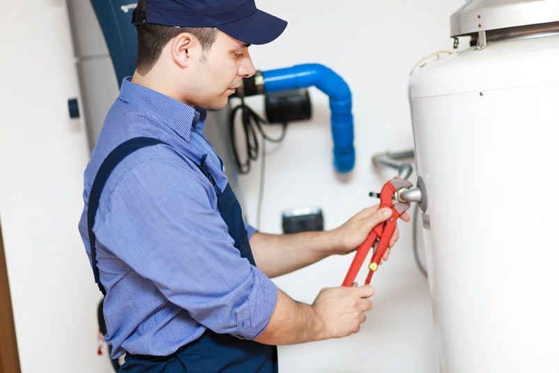 Plumber Repairing a Hot Water Boiler — Plumber Near Me In Australia
