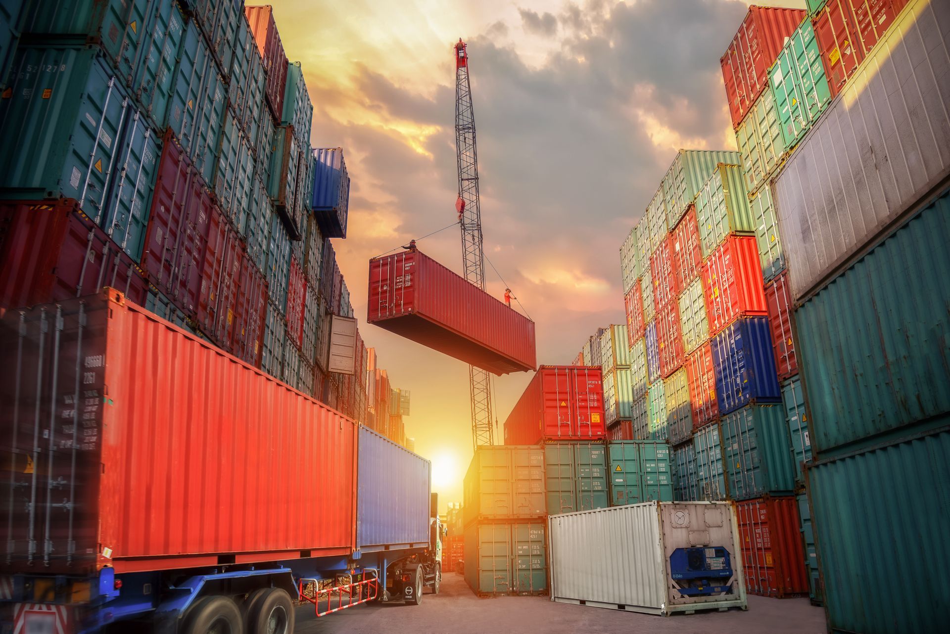 Industrial crane loading container to truck for logistic import export background. Industrial crane loading container to truck for logistic import export background.