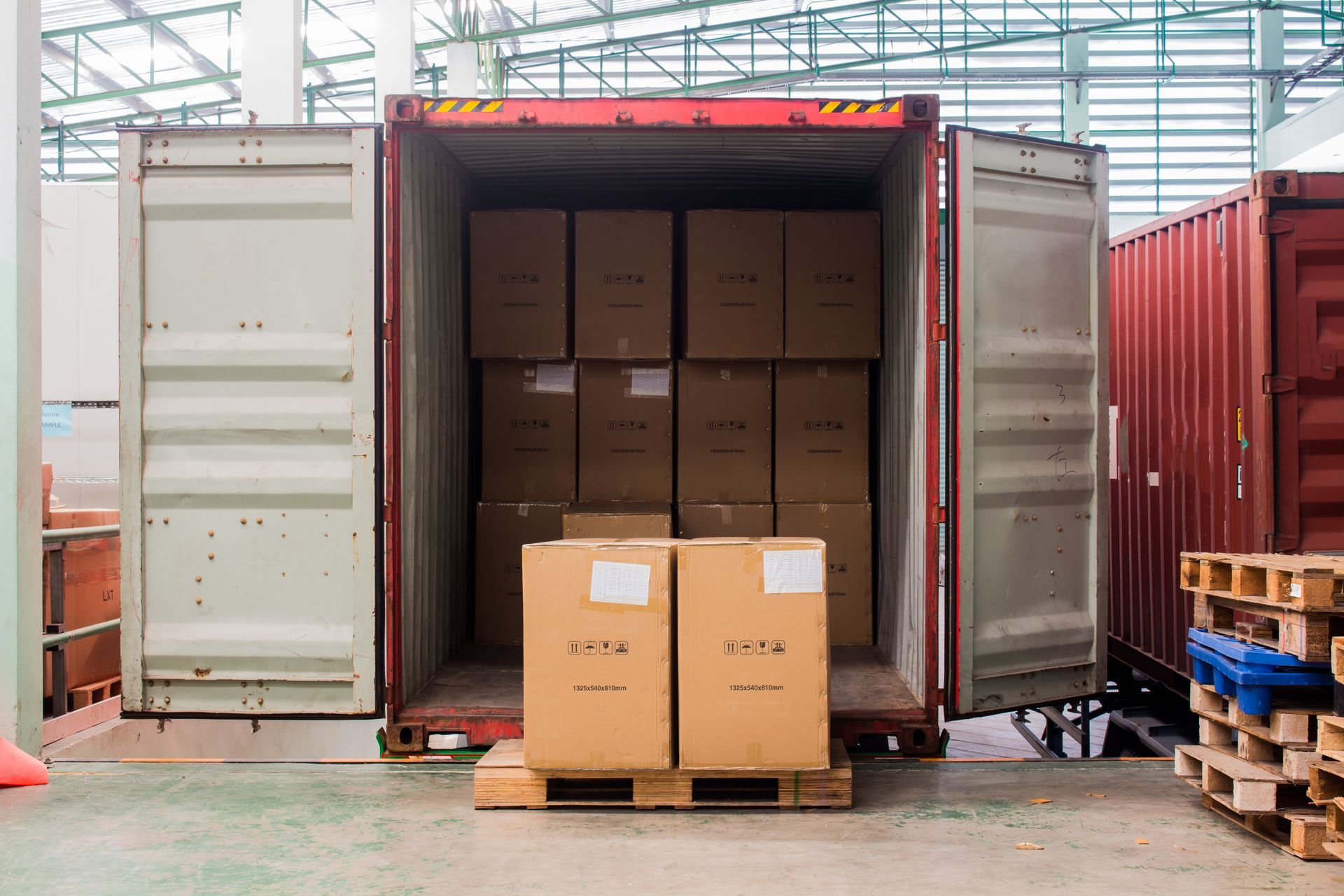 Storage container being unloaded on a delivery dock
