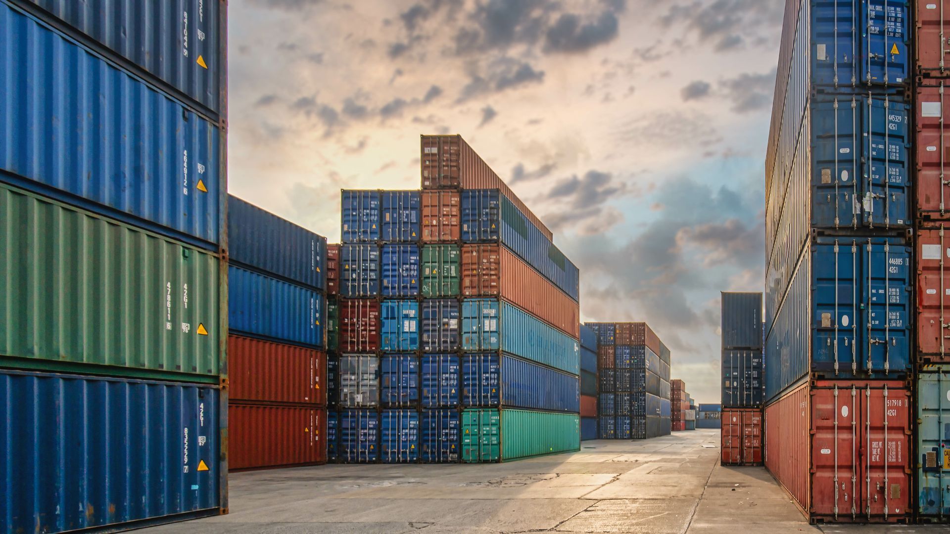 rows of steel storage containers at a local container supplier yard
