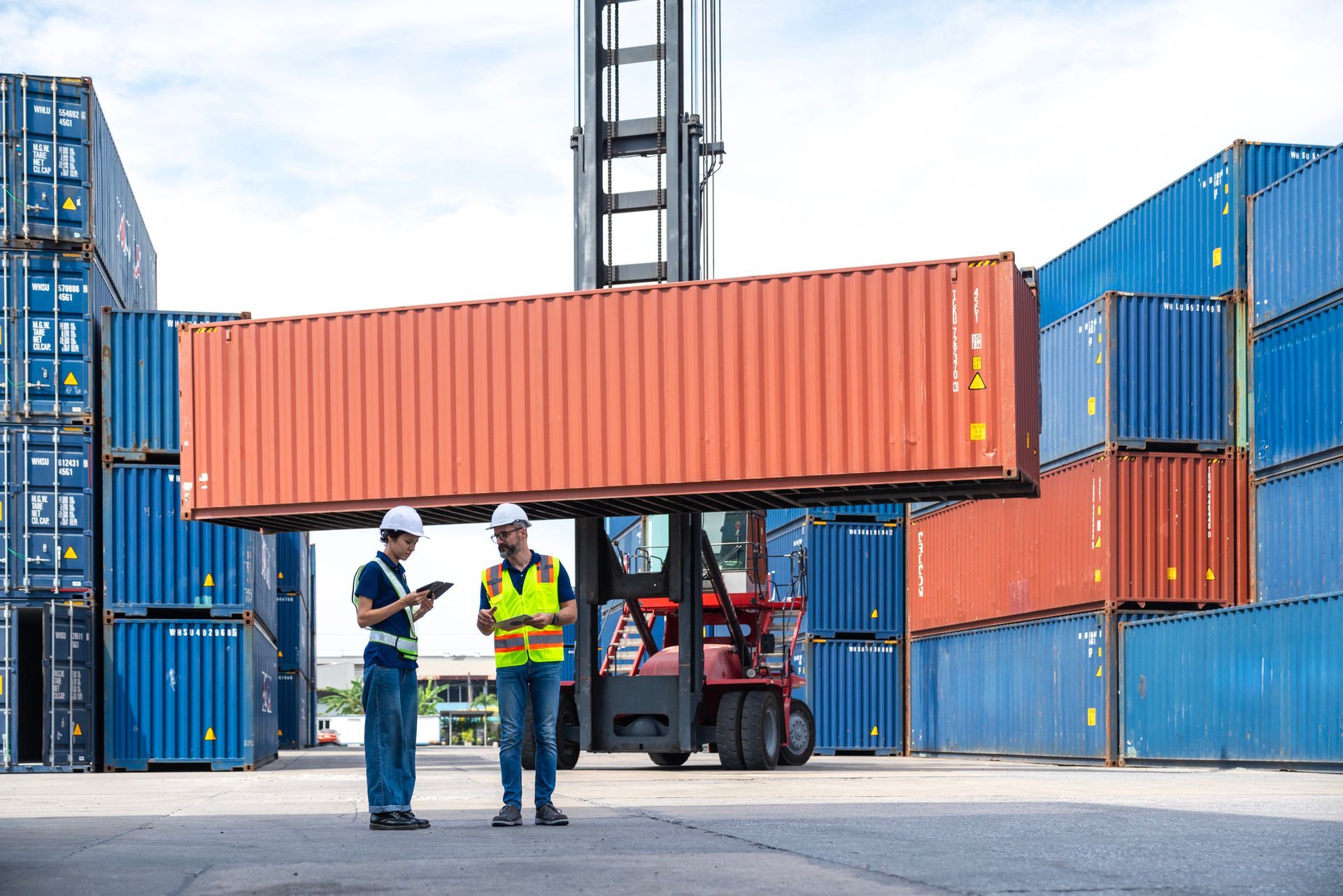 Two male and female engineers and tablets at container yard | Canton, OH 