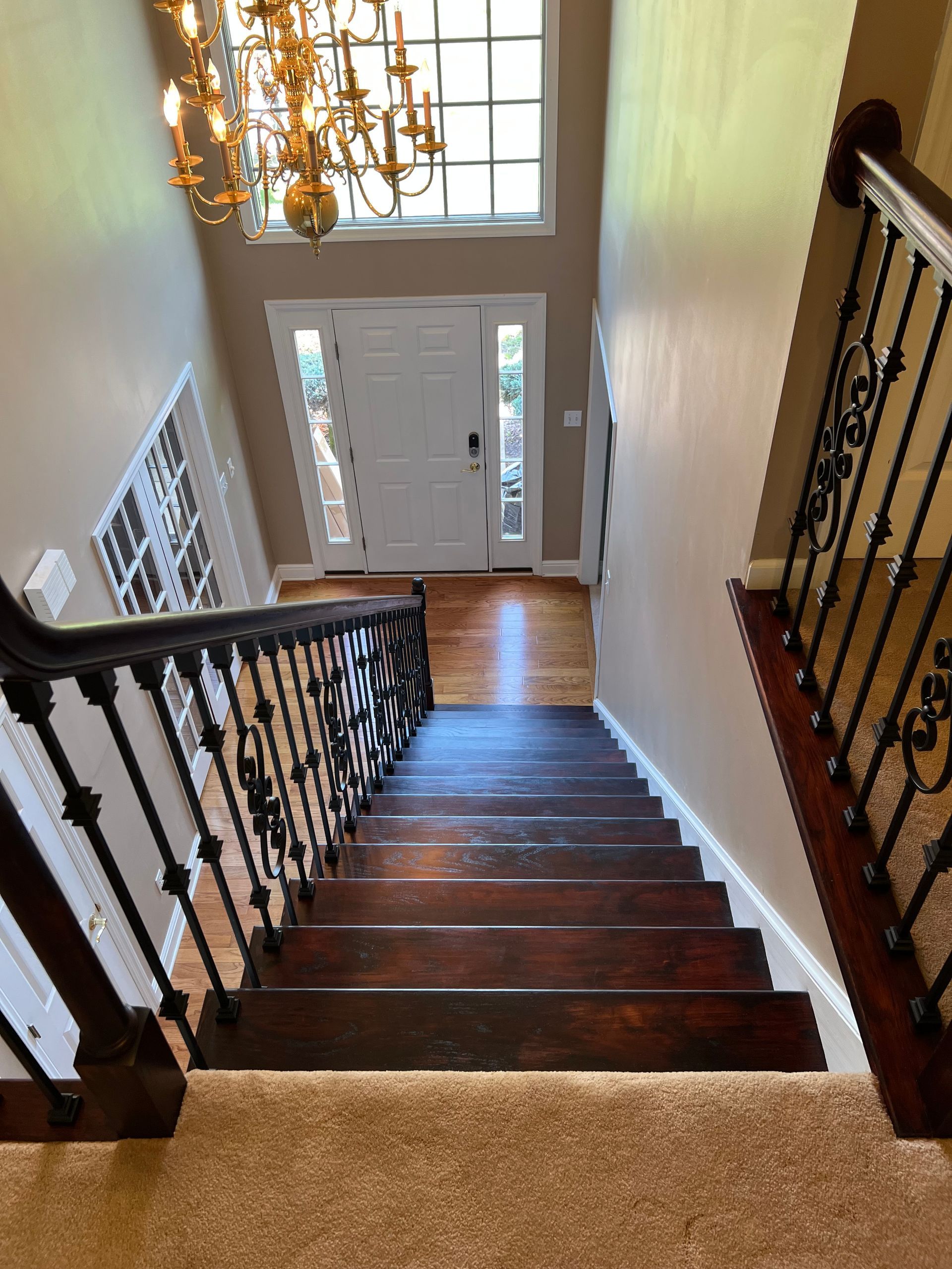 A view of a staircase leading up to the second floor of a house.