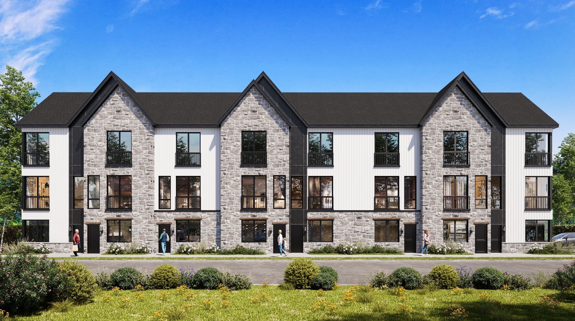 Modern three-story apartment building with stone and white siding, dark roof, and landscaped foreground under a blue sky