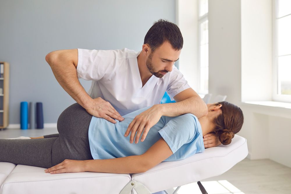 Chiropractor And Woman Patient — Rome, GA — Proctor-Keene Chiropractic Clinic