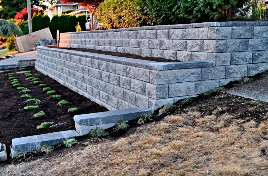 Gray Stone Retaining Wall With Built-in Planters — LD Carpentry in Bowral, NSW
