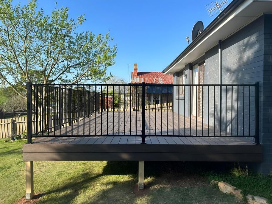 Deck With Black Railing, Attached to a House — LD Carpentry in Canberra, ACT