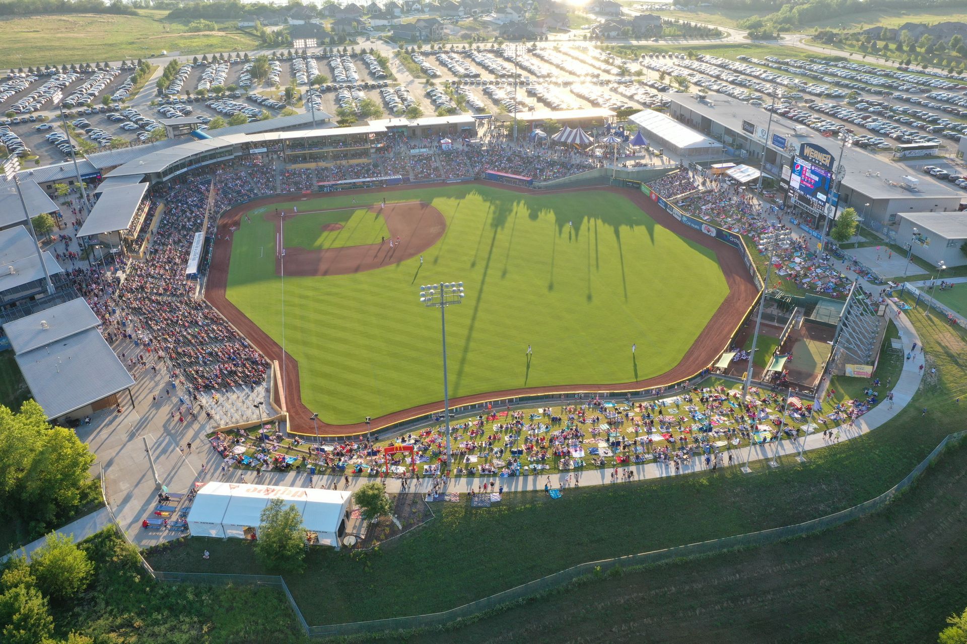 An aerial view of a baseball stadium filled with people