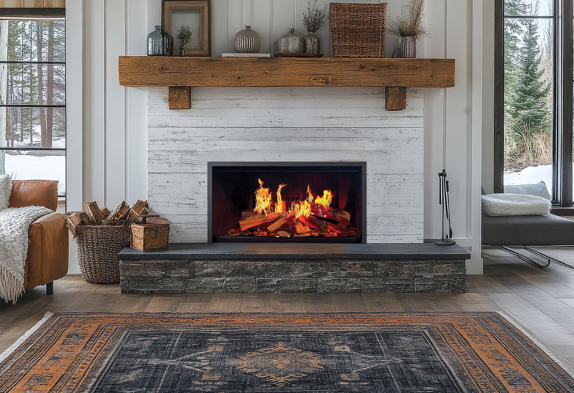 Modern living room with stone fireplace, burning fire, wood mantel, and winter decor, flanked by tall windows