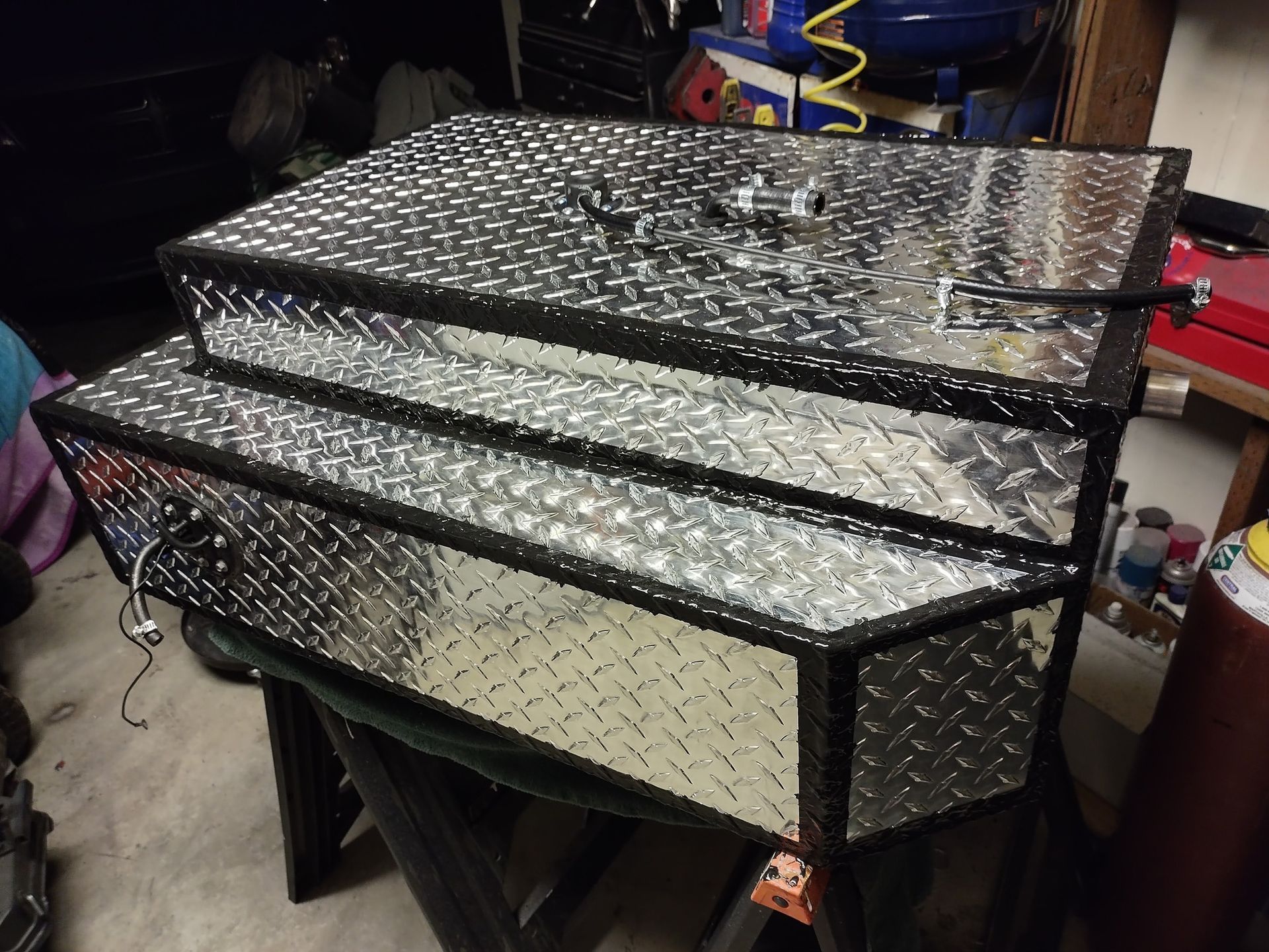 Three metal boxes are stacked on top of each other