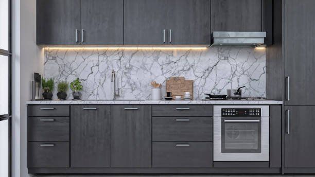 A kitchen with gray cabinets and a marble counter top - Luther Falls Kitchen & Bath - Champaign, IL