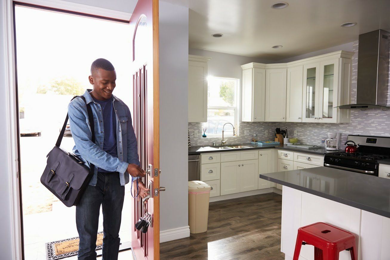Man Opening Door — Bloomington & Champaign, IL — Luther Falls Custom Kitchens Man Opening Door — Bloomington & Champaign, IL — Luther Falls Custom Kitchens