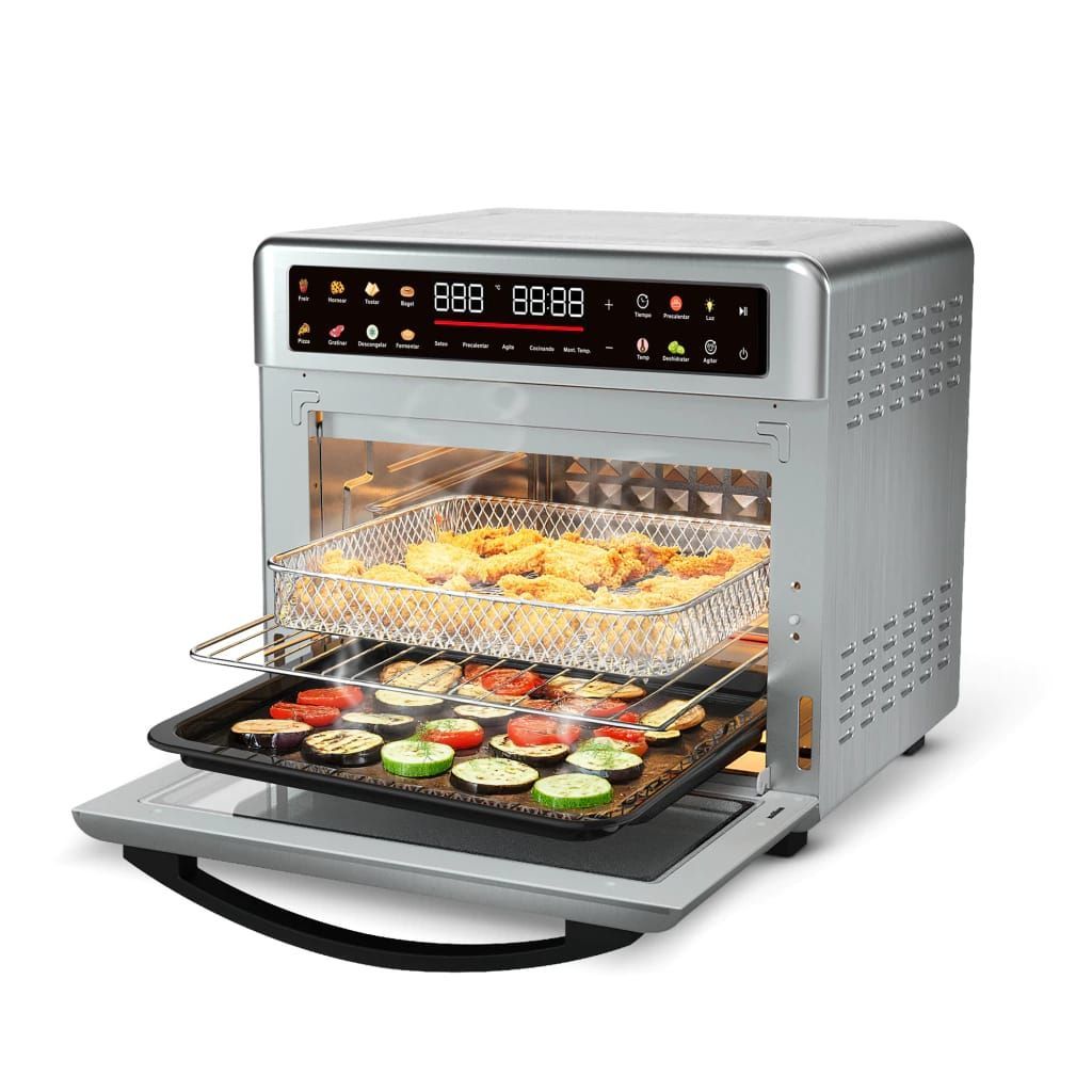 Horno freidora de aire plateado de sobremesa con la puerta abierta, con bandejas de comida cocinándose en el interior y en la rejilla.