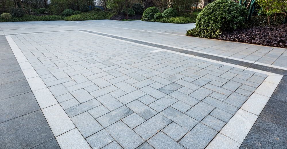 A Brick Driveway With a White Border in a Park — The Brick Paving Centre in Winnellie, NT