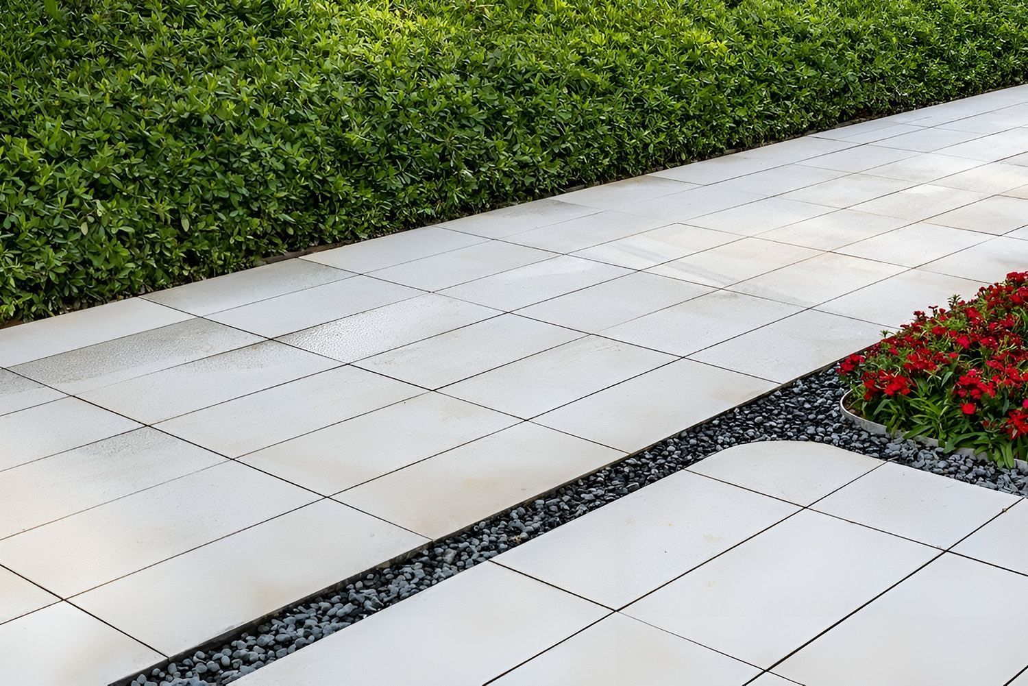 Brick Paver Walkway Next To A Green Hedge