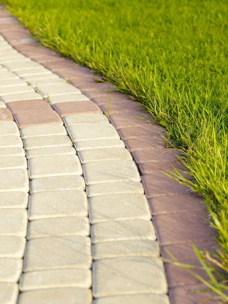 A Brick Walkway Leading to a Lush Green Lawn — The Brick Paving Centre in Winnellie, NT