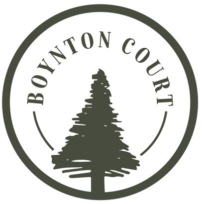 A logo for bonnton court with a pine tree in a circle.