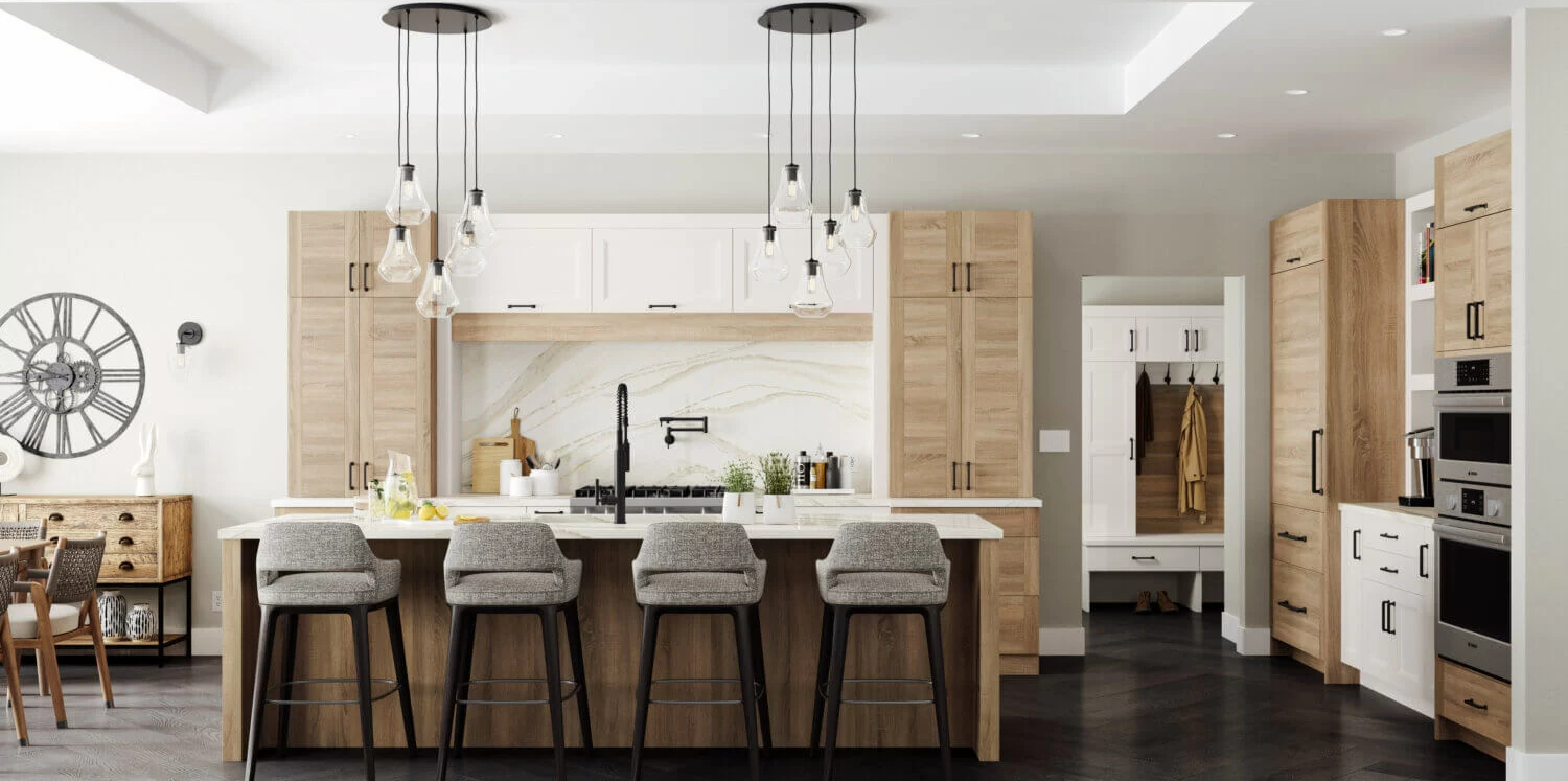 Bright modern kitchen with island, white cabinets, wood accents, and pendant lights
