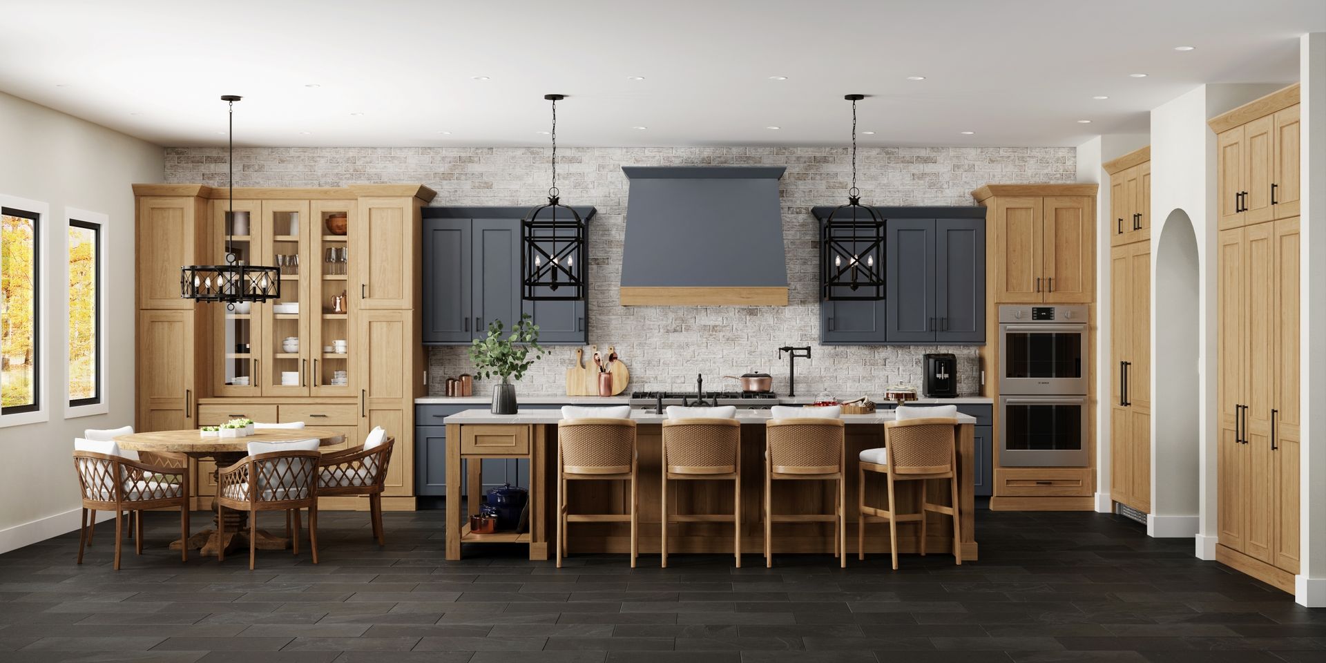 Spacious modern kitchen with wood cabinets, large island, pendant lights, and dining table seating