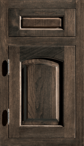 Dark wooden cabinet door with a mail slot and arched inset panel, shown closed.