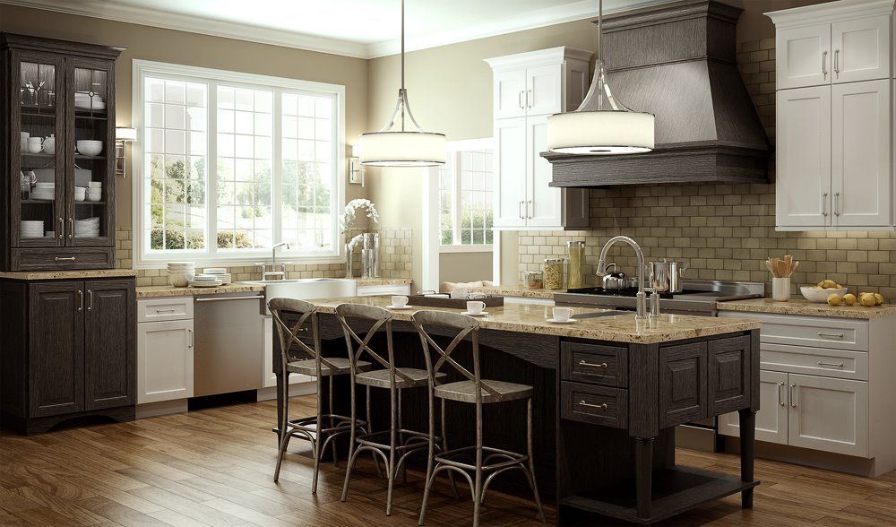 Modern kitchen with island, bar stools, white cabinets, and large window in neutral tones