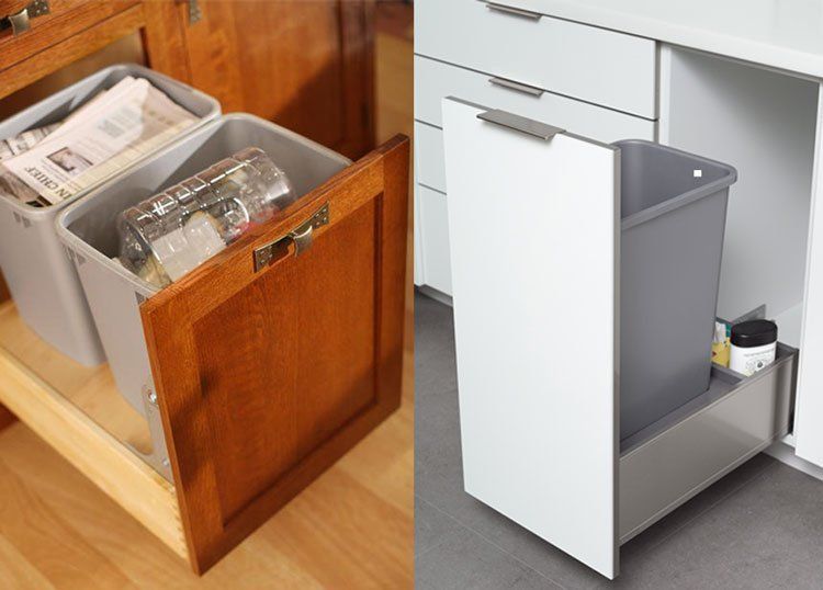 Two kitchen cabinets with pull-out trash bins, one wooden and one white, shown open.