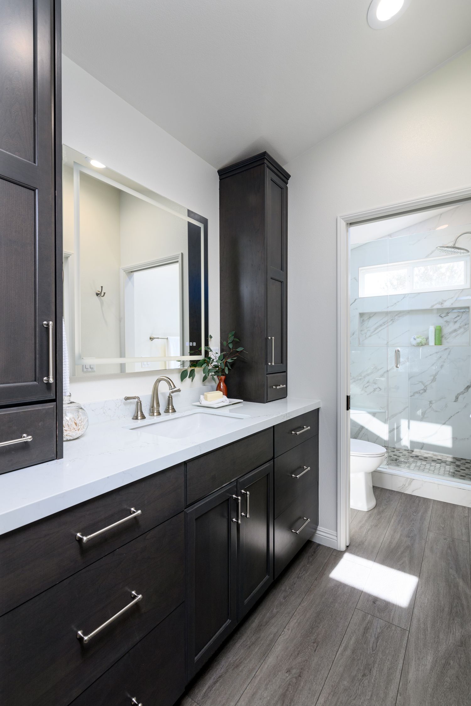 dark stained vanity, Omega Full Access  Cabinetry, white quartz countertops, large format shower tile,  master bathroom remodel, thousand oaks 