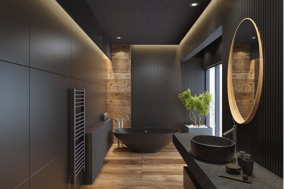 Modern bathroom with dark wood paneling, round mirror, bathtub, and sink under warm lighting
