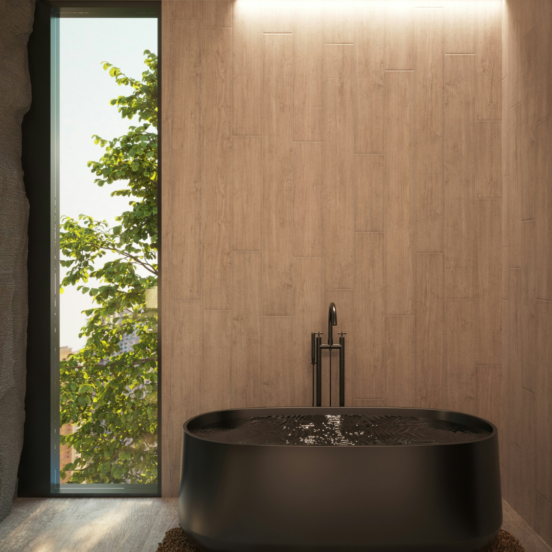 Modern bathroom with a black freestanding tub, wood wall, and tall window showing greenery