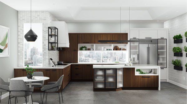 Modern open-plan kitchen and dining area with dark wood cabinets, white walls, gray floor, and pendant lighting