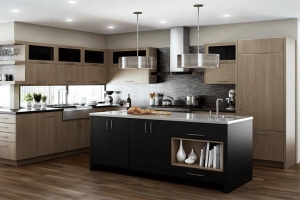 Modern kitchen with wood cabinets, black island, stainless steel appliances, and pendant lights