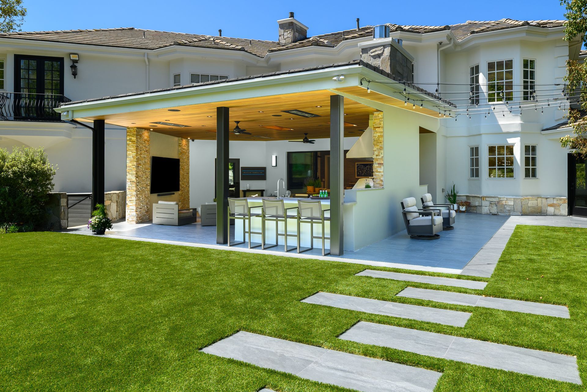 Custom covered outdoor living space with steel structure, outdoor kitchen, and lounge, Country Club Estates Westlake Village remodel by Westside Remodeling