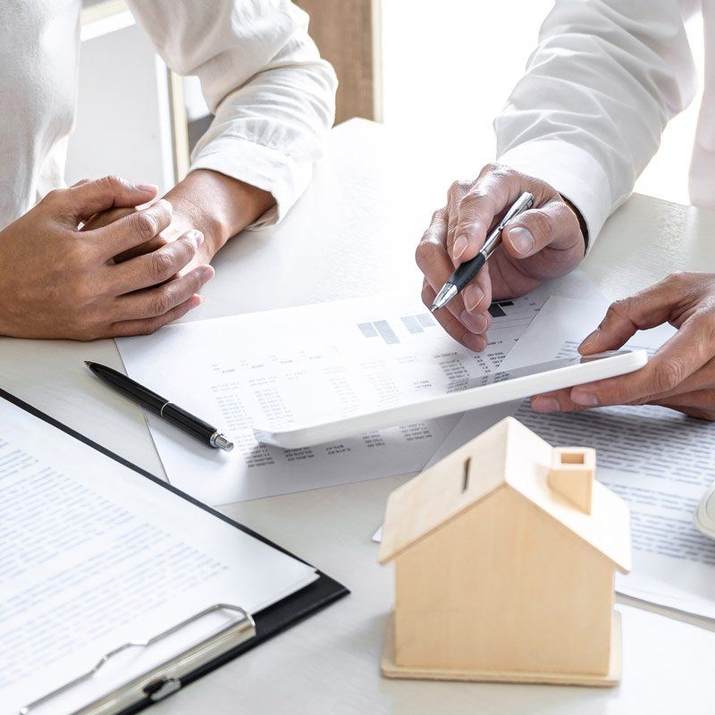 people looking at paperwork