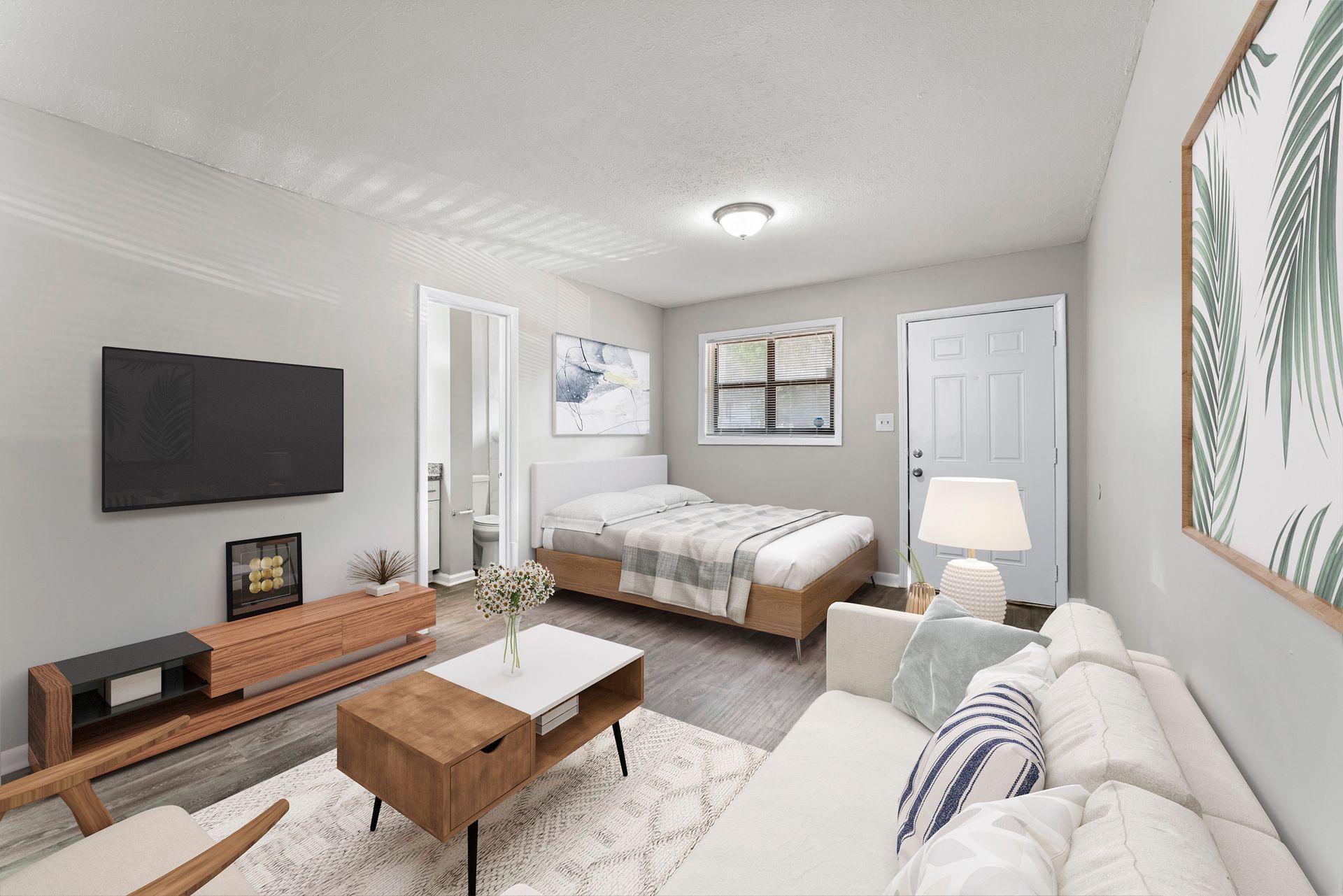 Bright modern bedroom with bed, sofa, wall TV, and open door to balcony.