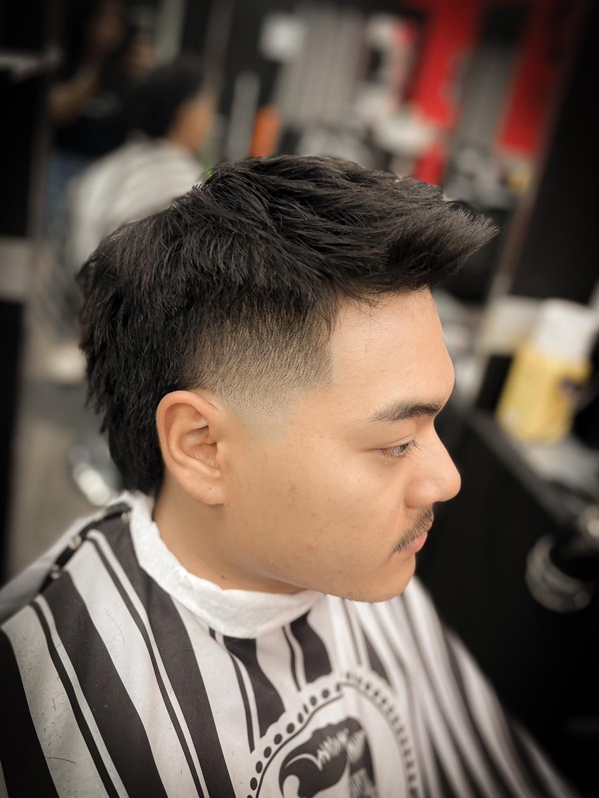 A Man Sporting a Stylish Look Is Getting His Hair Done at a Barbershop — Hair Obsession Barber in Nightcliff, NT